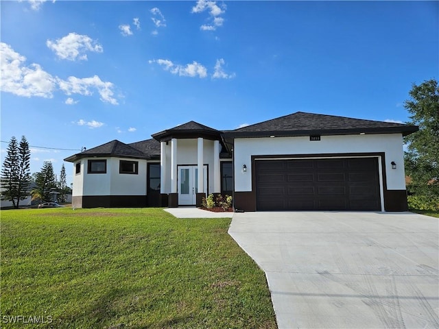 3418 12th St W, Lehigh Acres, FL 33971 - view of front of house with a garage, stucco siding, driveway, and a front lawn