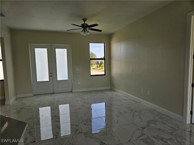 3418 12th St W, Lehigh Acres, FL 33971 - entrance foyer featuring marble finish floors, baseboards, and french doors