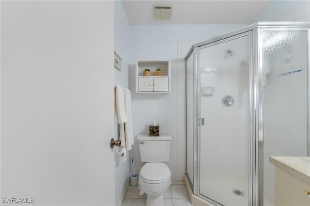 25100 Sandhill Blvd Unit R202, Punta Gorda, FL 33983 - bathroom featuring tile patterned floors, a stall shower, and toilet