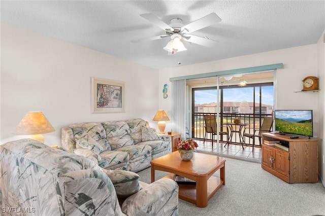 25100 Sandhill Blvd Unit R202, Punta Gorda, FL 33983 - living area featuring ceiling fan, light colored carpet, and a textured ceiling
