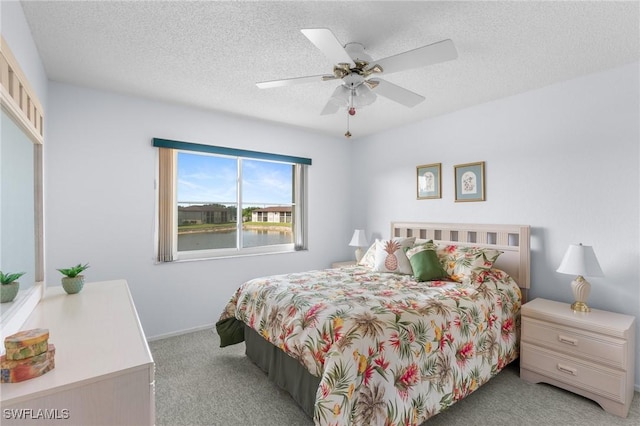 25100 Sandhill Blvd Unit R202, Punta Gorda, FL 33983 - carpeted bedroom with a textured ceiling and ceiling fan