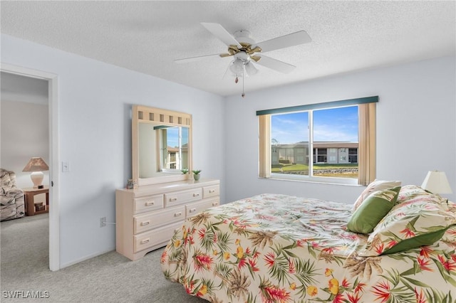 25100 Sandhill Blvd Unit R202, Punta Gorda, FL 33983 - bedroom featuring light colored carpet, a textured ceiling, and a ceiling fan