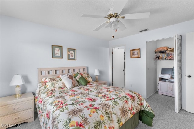25100 Sandhill Blvd Unit R202, Punta Gorda, FL 33983 - bedroom featuring carpet floors, a ceiling fan, a closet, and a walk in closet