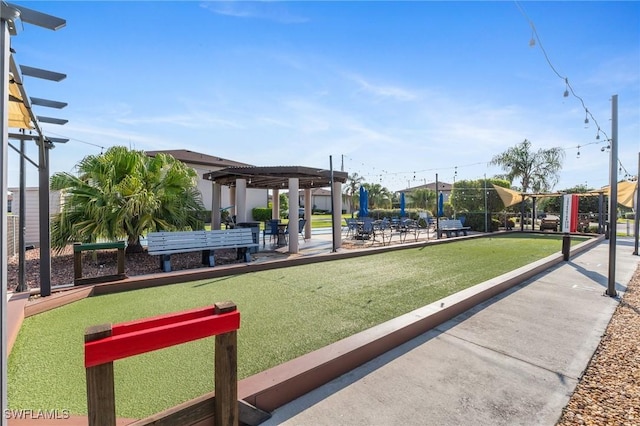 25100 Sandhill Blvd Unit R202, Punta Gorda, FL 33983 - view of home's community featuring a game area and a pergola