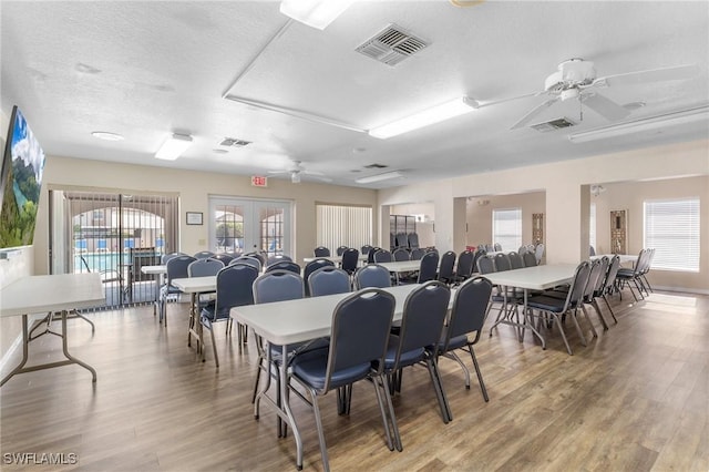 25100 Sandhill Blvd Unit R202, Punta Gorda, FL 33983 - dining room with a ceiling fan, light wood-style floors, and a textured ceiling