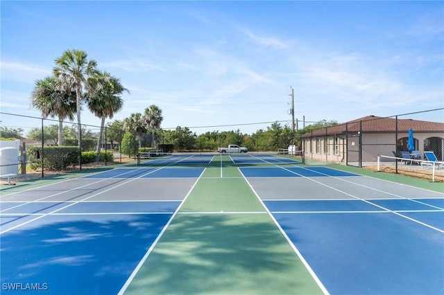 25100 Sandhill Blvd Unit R202, Punta Gorda, FL 33983 - view of tennis court featuring community basketball court and fence
