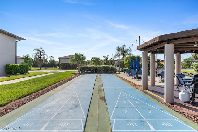 25100 Sandhill Blvd Unit R202, Punta Gorda, FL 33983 - view of community with shuffleboard and a lawn