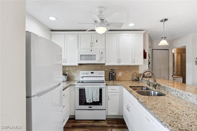 25100 Sandhill Blvd Unit 201, Punta Gorda, FL 33983 - kitchen with white appliances, a sink, white cabinetry, light stone countertops, and recessed lighting