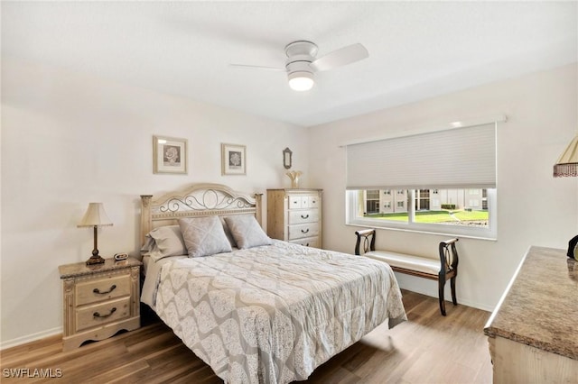 25100 Sandhill Blvd Unit 201, Punta Gorda, FL 33983 - bedroom featuring wood finished floors, baseboards, and ceiling fan