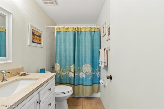25100 Sandhill Blvd Unit 201, Punta Gorda, FL 33983 - bathroom with tile patterned flooring, toilet, and vanity