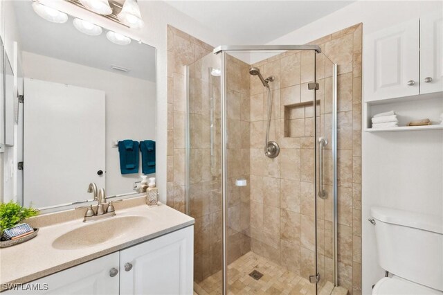 25100 Sandhill Blvd Unit 201, Punta Gorda, FL 33983 - full bath with a shower stall, toilet, and vanity