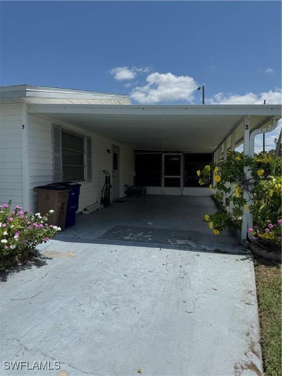 5 Desert Candle Cir, Lehigh Acres, FL 33936 - view of front of property with driveway and a carport