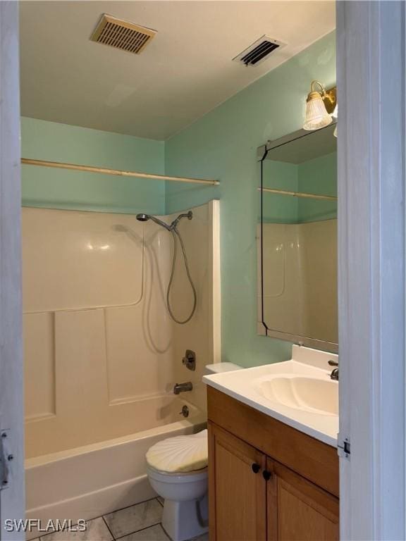 5 Desert Candle Cir, Lehigh Acres, FL 33936 - full bath with toilet, vanity, tile patterned flooring, and shower / tub combination
