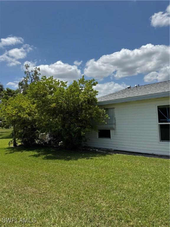 5 Desert Candle Cir, Lehigh Acres, FL 33936 - view of green lawn
