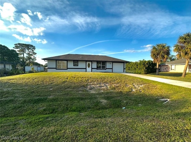 803 Monroe Dr, Lehigh Acres, FL 33936 - single story home featuring driveway, a garage, stucco siding, and a front yard