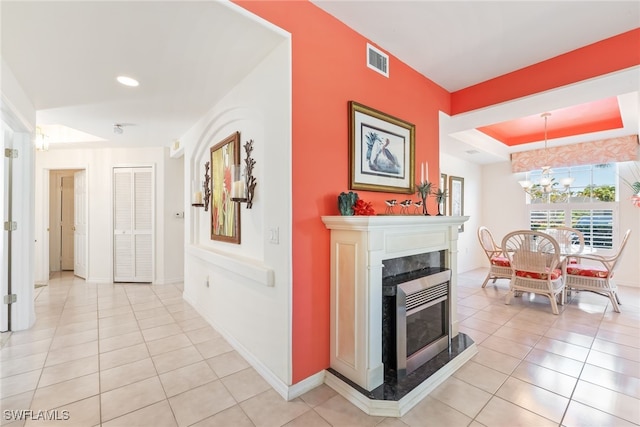 14521 Grande Cay Cir Unit 2902, Fort Myers, FL 33908 - corridor featuring light tile patterned floors, a chandelier, a tray ceiling, baseboards, and recessed lighting
