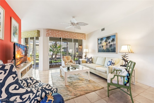 14521 Grande Cay Cir Unit 2902, Fort Myers, FL 33908 - tiled living room with a ceiling fan and baseboards