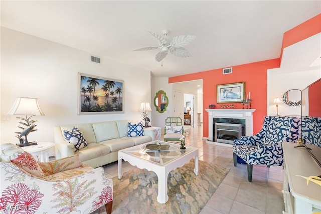14521 Grande Cay Cir Unit 2902, Fort Myers, FL 33908 - living area featuring light tile patterned floors, a premium fireplace, and ceiling fan