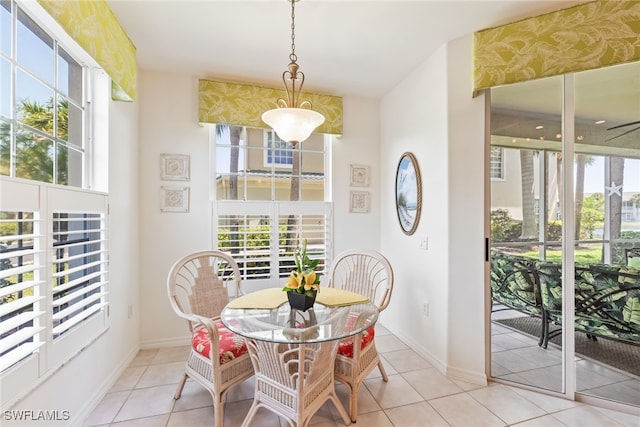 14521 Grande Cay Cir Unit 2902, Fort Myers, FL 33908 - dining area with plenty of natural light, light tile patterned floors, and baseboards