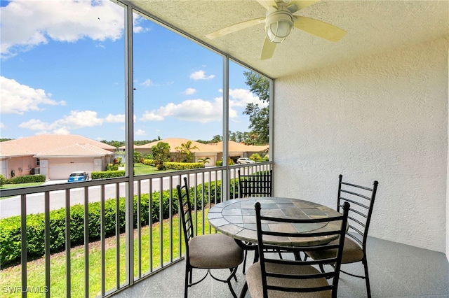 7839 Regal Heron Cir Unit 205, Naples, FL 34104 - sunroom with ceiling fan, a residential view, and outdoor dining area