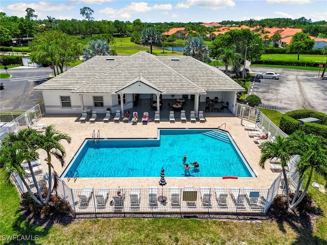 7839 Regal Heron Cir Unit 205, Naples, FL 34104 - community pool featuring fence, a patio area, and view of wooded area
