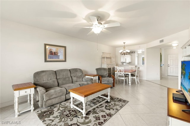 7839 Regal Heron Cir Unit 205, Naples, FL 34104 - living room with a ceiling fan, light tile patterned floors, and a chandelier