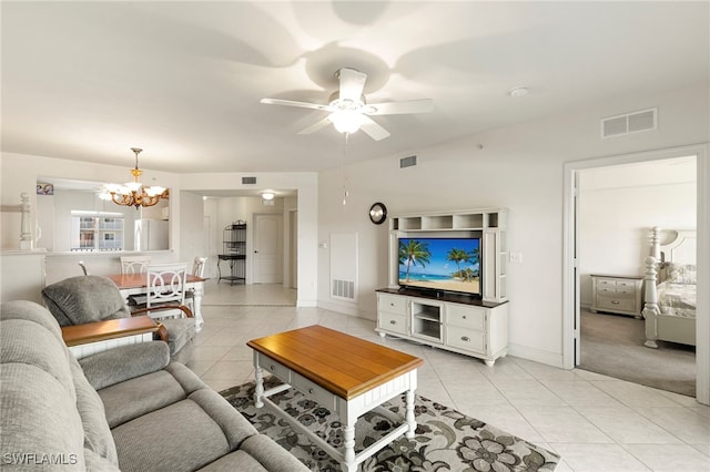 7839 Regal Heron Cir Unit 205, Naples, FL 34104 - living room featuring light tile patterned flooring, a chandelier, a ceiling fan, and baseboards