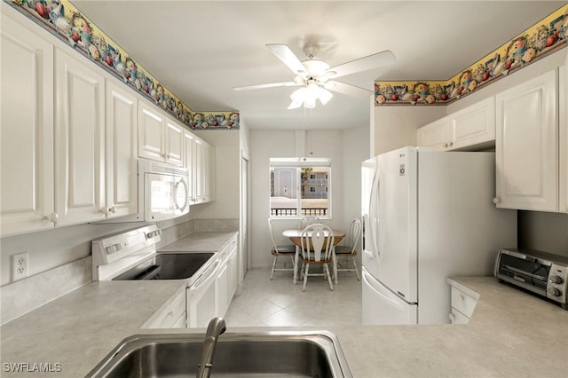 7839 Regal Heron Cir Unit 205, Naples, FL 34104 - kitchen featuring white appliances, a sink, light countertops, ceiling fan, and light tile patterned floors