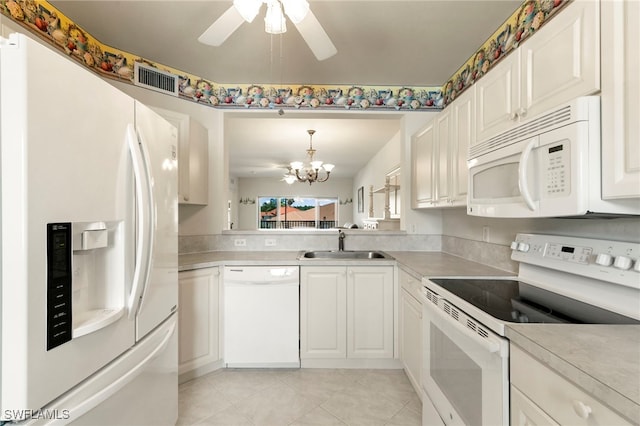 7839 Regal Heron Cir Unit 205, Naples, FL 34104 - kitchen with white appliances, a sink, a chandelier, ceiling fan, and light tile patterned floors