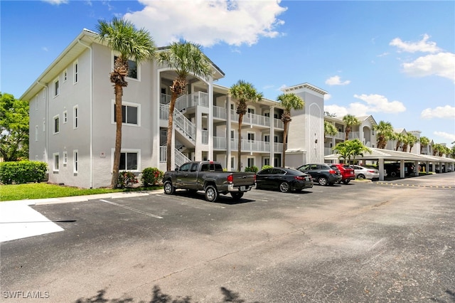 7839 Regal Heron Cir Unit 205, Naples, FL 34104 - view of apartment building / complex with uncovered parking