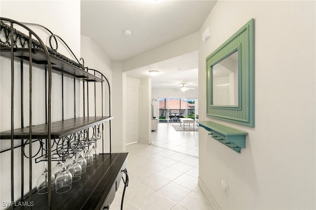 7839 Regal Heron Cir Unit 205, Naples, FL 34104 - hallway with light tile patterned floors and baseboards
