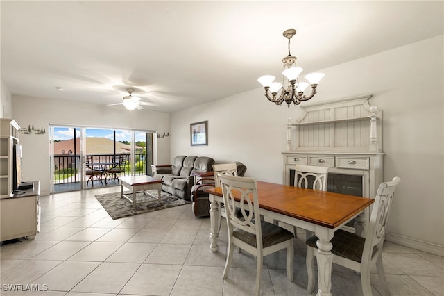 7839 Regal Heron Cir Unit 205, Naples, FL 34104 - dining space featuring a chandelier, ceiling fan, and light tile patterned flooring