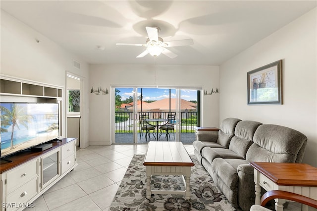 7839 Regal Heron Cir Unit 205, Naples, FL 34104 - living room with a ceiling fan and light tile patterned floors