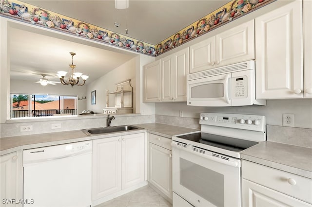 7839 Regal Heron Cir Unit 205, Naples, FL 34104 - kitchen with white appliances, a sink, a chandelier, and light countertops
