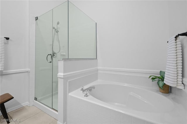 12839 Oakpointe Cir, Fort Myers, FL 33912 - bathroom featuring a bath, a shower stall, and tile patterned flooring