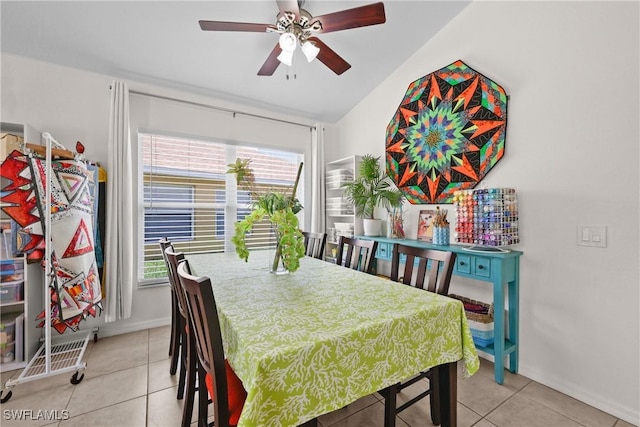 12839 Oakpointe Cir, Fort Myers, FL 33912 - dining room with light tile patterned flooring, a ceiling fan, vaulted ceiling, and baseboards