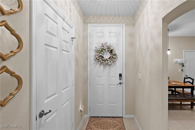17504 Cherry Ridge Ln, Fort Myers, FL 33967 - foyer entrance with light tile patterned floors, arched walkways, and baseboards