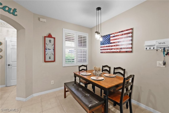 17504 Cherry Ridge Ln, Fort Myers, FL 33967 - dining space featuring arched walkways, baseboards, and light tile patterned floors