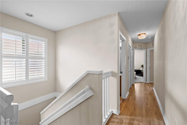 17504 Cherry Ridge Ln, Fort Myers, FL 33967 - hall featuring light wood-style floors, an upstairs landing, and baseboards