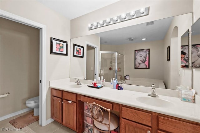 17504 Cherry Ridge Ln, Fort Myers, FL 33967 - full bathroom featuring double vanity, a shower stall, tile patterned flooring, toilet, and baseboards