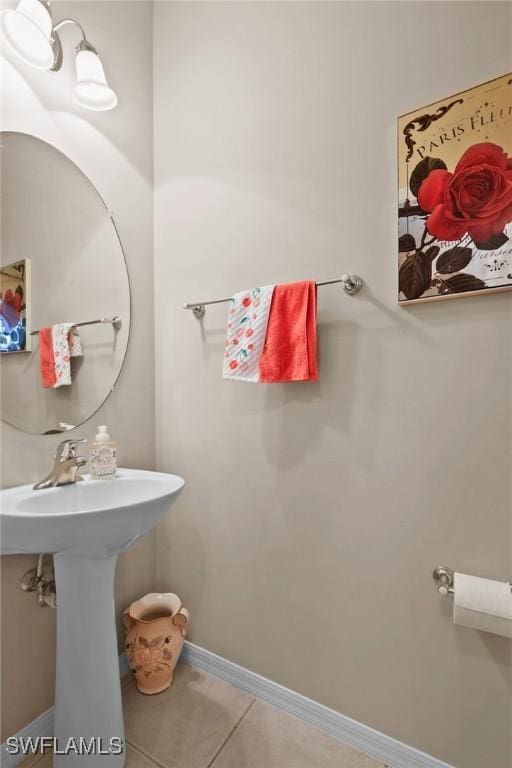 17504 Cherry Ridge Ln, Fort Myers, FL 33967 - bathroom featuring tile patterned flooring, a sink, and baseboards