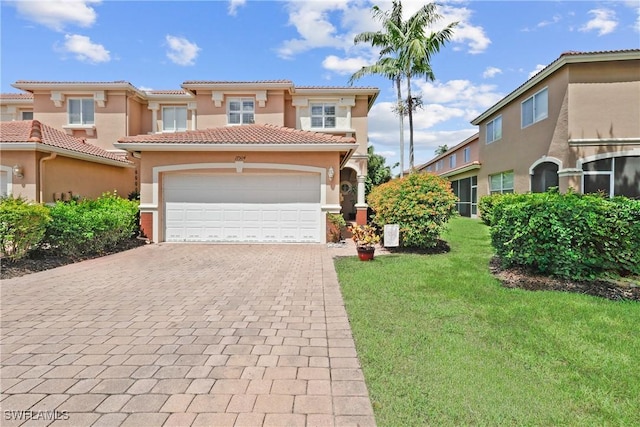 17504 Cherry Ridge Ln, Fort Myers, FL 33967 - mediterranean / spanish-style home with a tile roof, decorative driveway, stucco siding, a front yard, and a garage