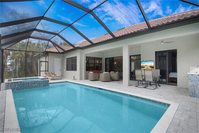 610 25th Ave NW, Naples, FL 34120 - view of swimming pool with a patio area, a ceiling fan, a pool with connected hot tub, and glass enclosure