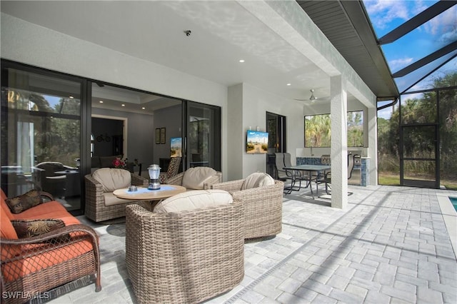 610 25th Ave NW, Naples, FL 34120 - view of patio / terrace with outdoor dining space, ceiling fan, a lanai, and an outdoor living space