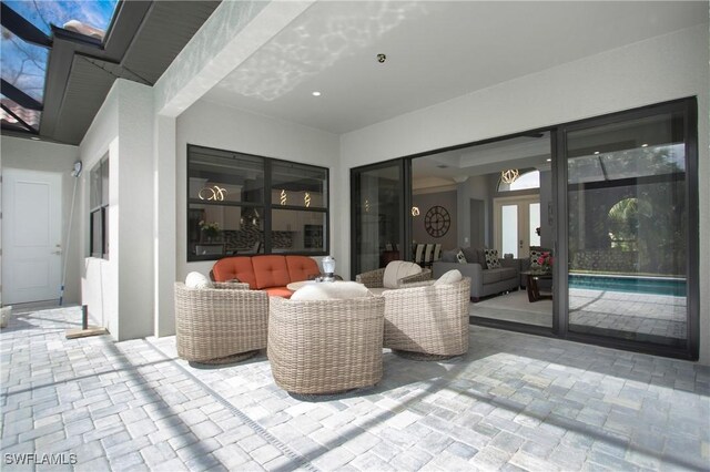 610 25th Ave NW, Naples, FL 34120 - view of patio featuring an outdoor hangout area