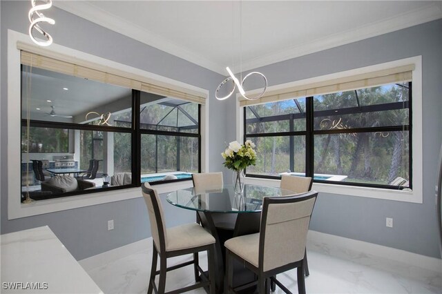 610 25th Ave NW, Naples, FL 34120 - dining room featuring marble finish flooring, crown molding, and baseboards