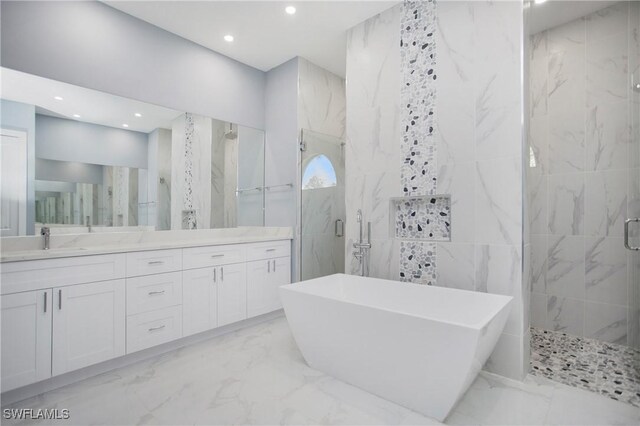 610 25th Ave NW, Naples, FL 34120 - full bathroom with a marble finish shower, marble tiled floors, tile walls, a freestanding bath, and recessed lighting