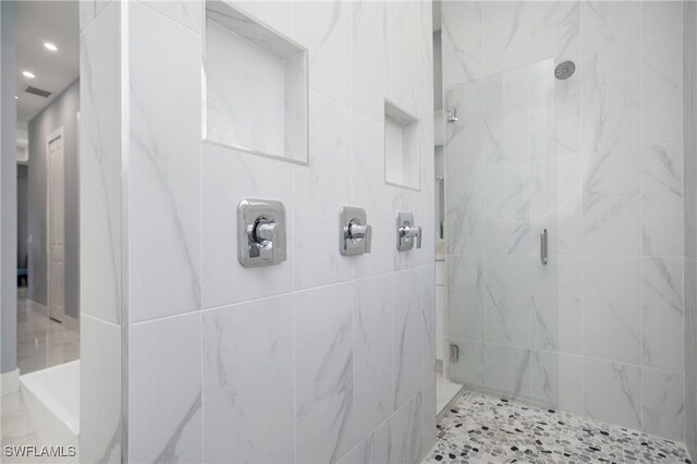610 25th Ave NW, Naples, FL 34120 - bathroom with a stall shower and recessed lighting