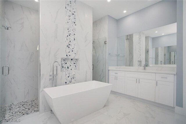 610 25th Ave NW, Naples, FL 34120 - bathroom featuring a marble finish shower, marble tiled flooring, tile walls, recessed lighting, and a freestanding bath