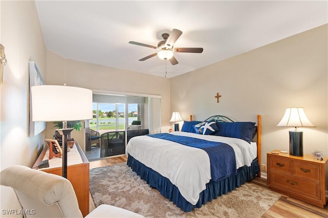 13020 Amberley Ct Unit 301, Bonita Springs, FL 34135 - bedroom with access to exterior, light wood-style floors, and ceiling fan